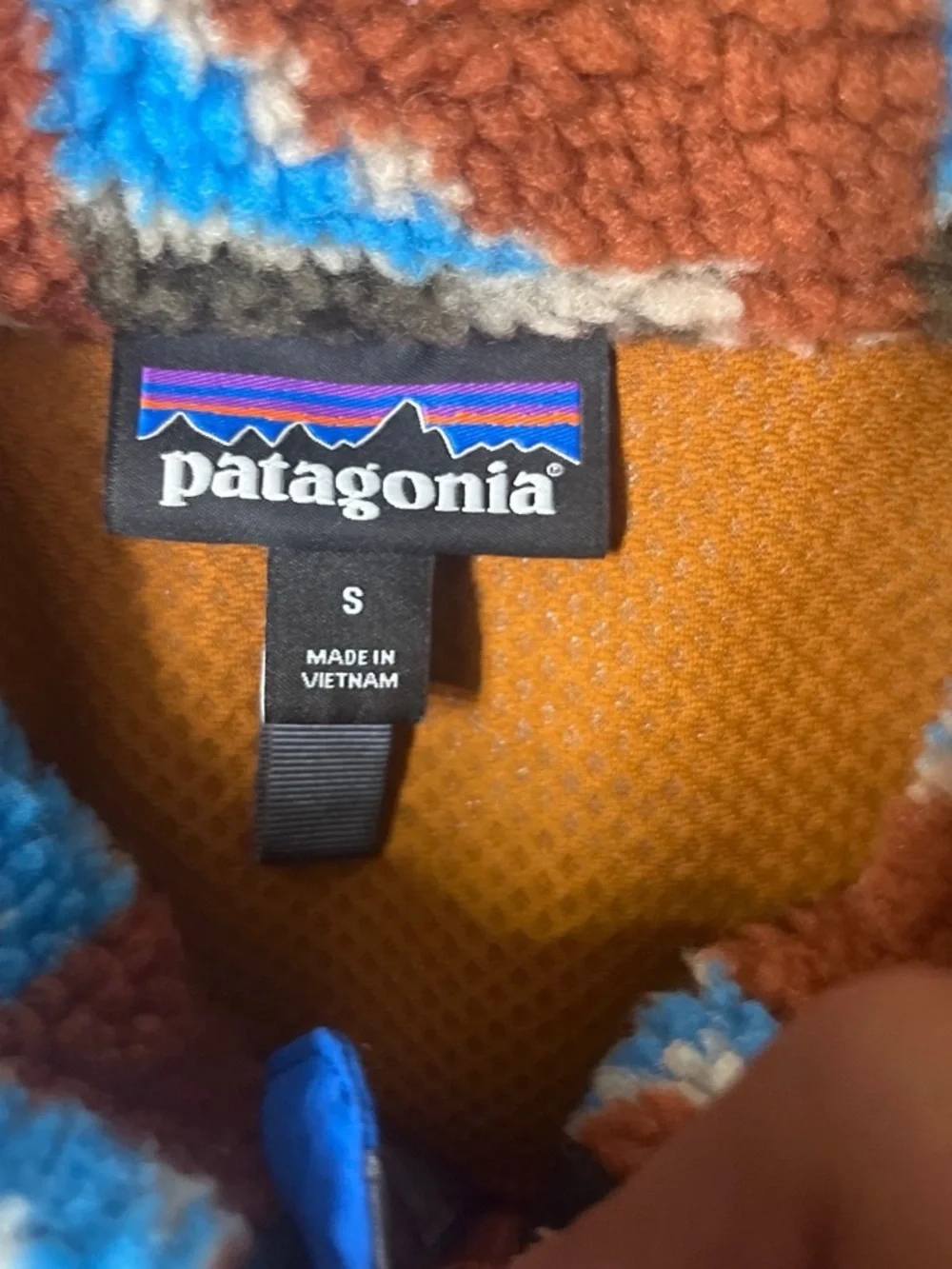 Patagonia sherpa fleece jacket in bright blue and brown pattern